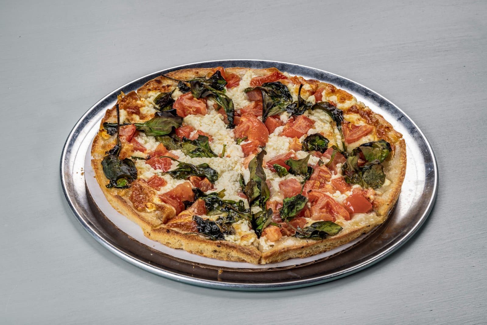Tomato basil pizza with feta
