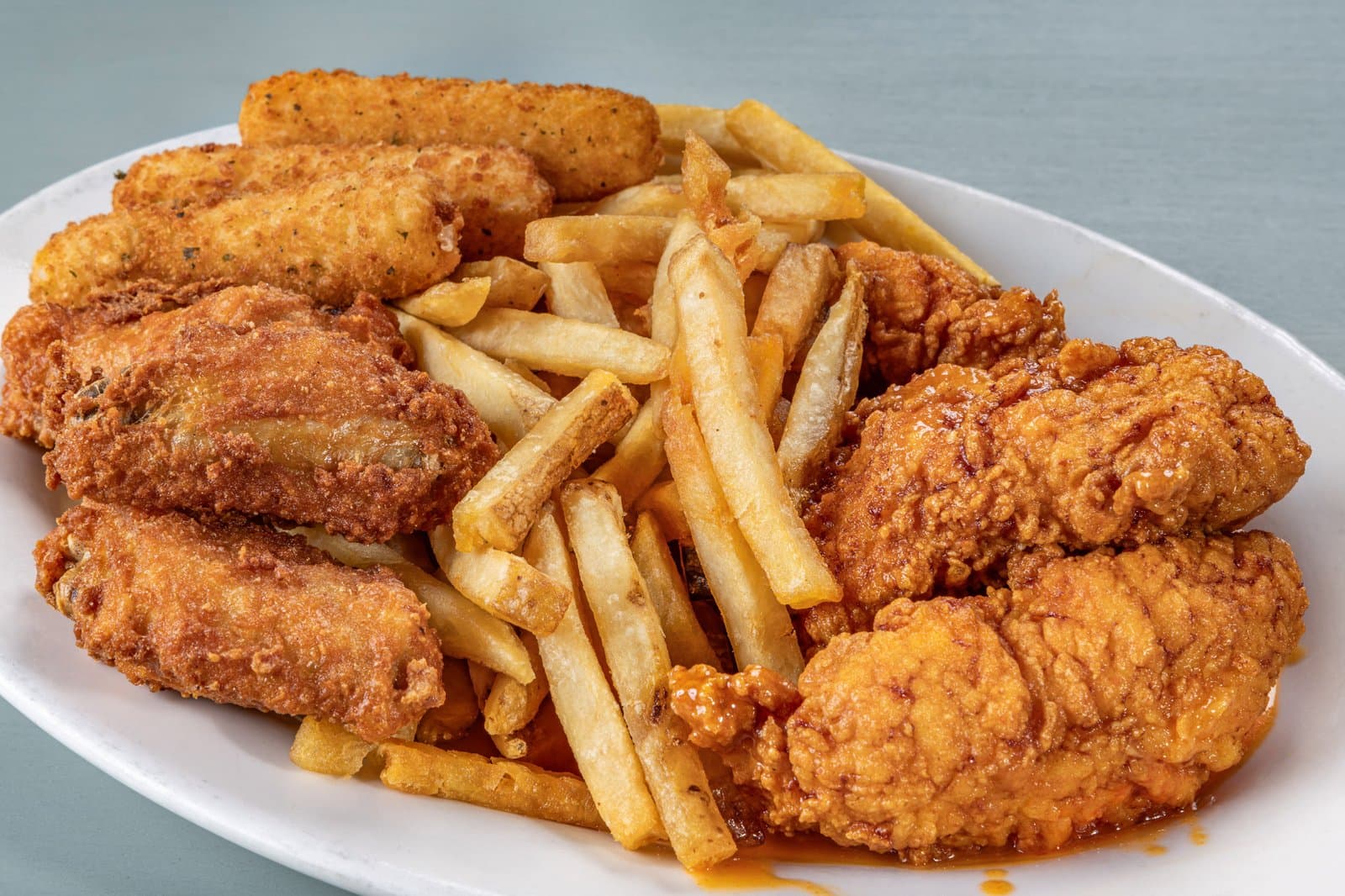 Wings and tenders combo platter with mozzarella sticks